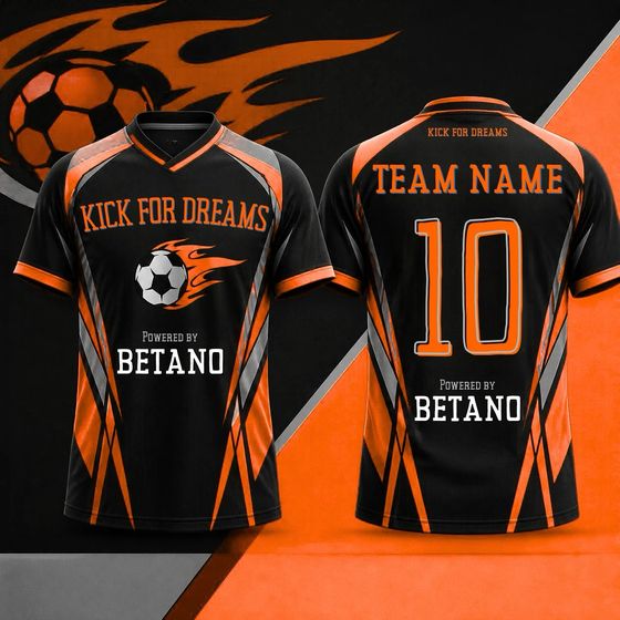 Away kit (Kick for Dreams): Black with orange and grey panels, powered by Betano.